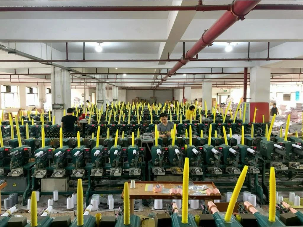 The workshop team and thread winding stations.